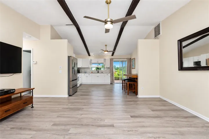 View as you enter the front door looking through the living room, dinette and kitchen to the lanai.