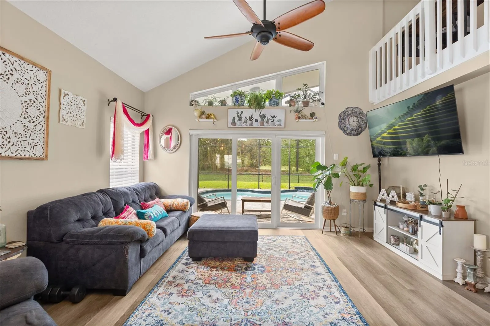 LIVING ROOM W/ POOL VIEW