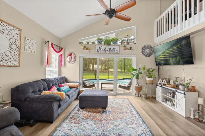 LIVING ROOM W/ POOL VIEW