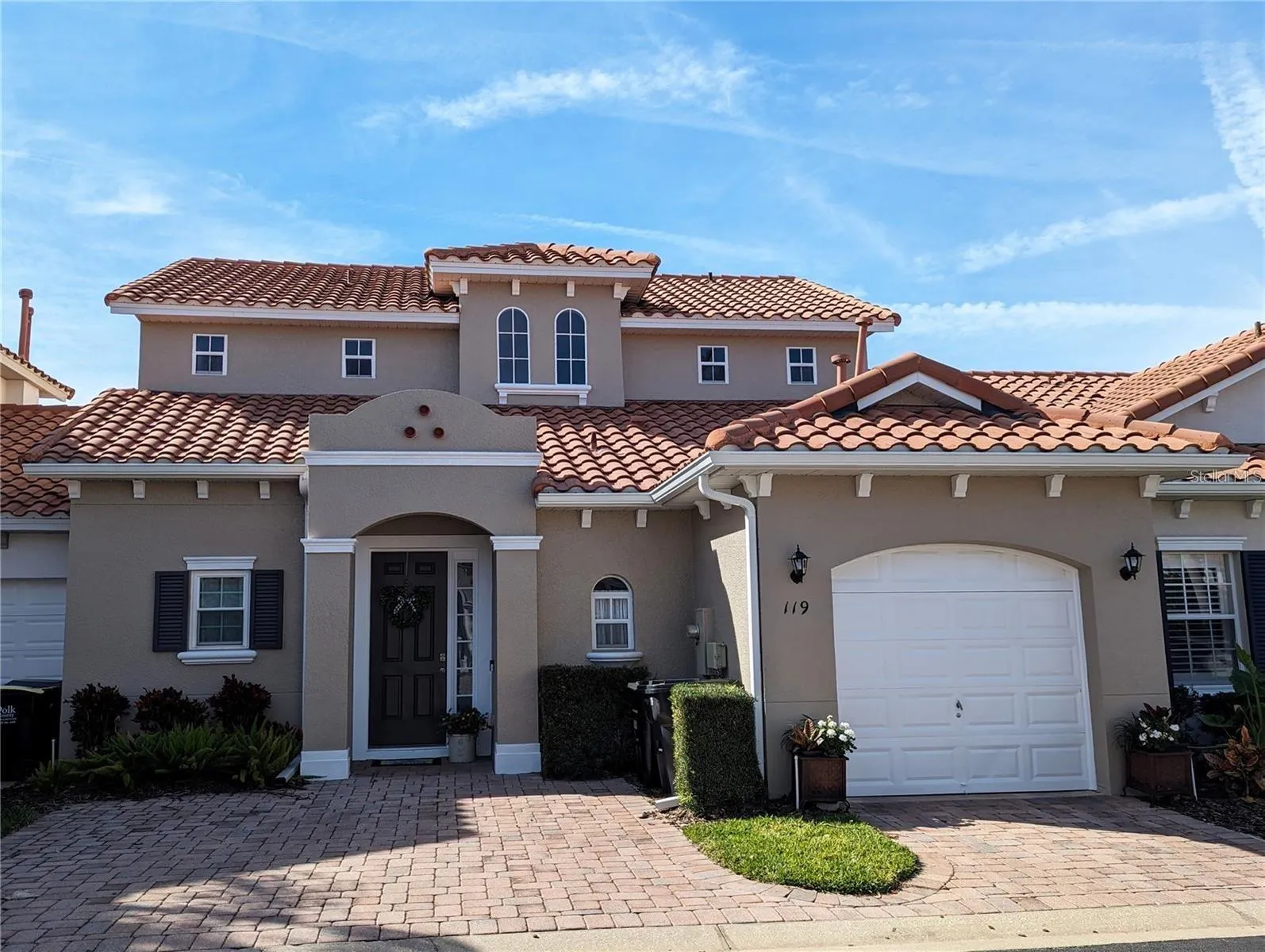 Front of home with paved driveway