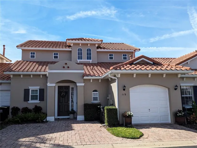 Front of home with paved driveway
