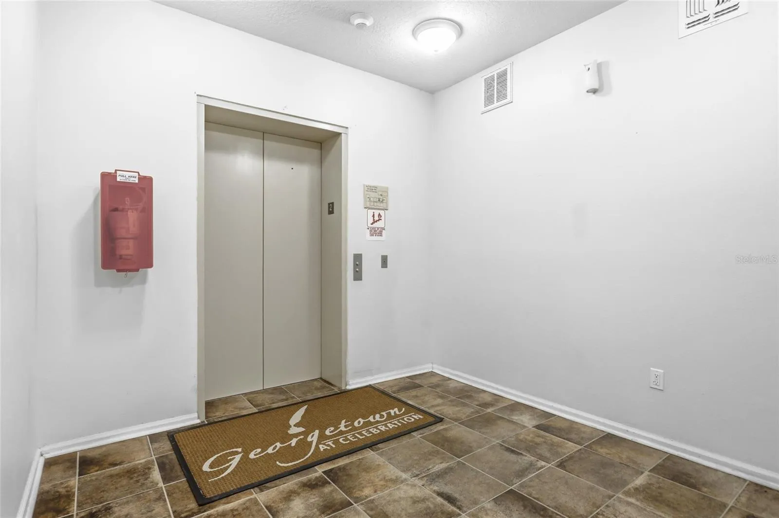Elevator and stairs in building.