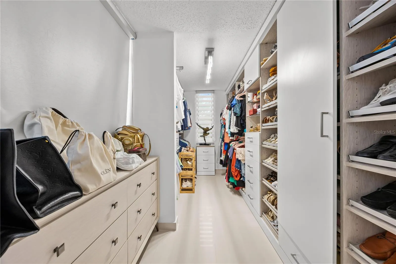 Completely renovated walk-in closet in the primary suite, a dressing room made for everyday ease