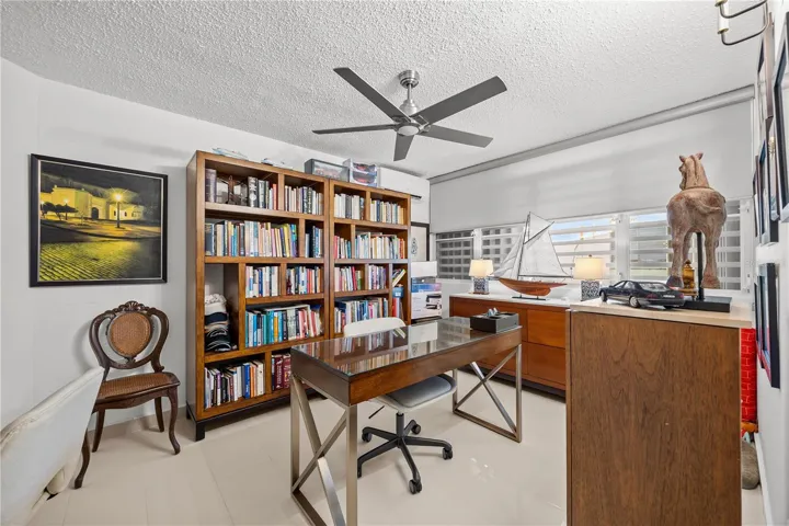 Currently used as a home office, this bedroom can easily go back to being a comfortable room for anyone in the family