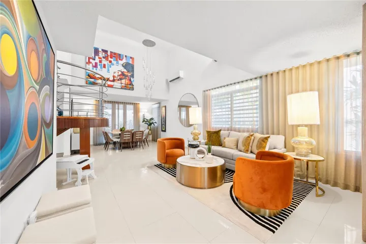 Open living and dining areas with double height ceilings and sweeping sightlines