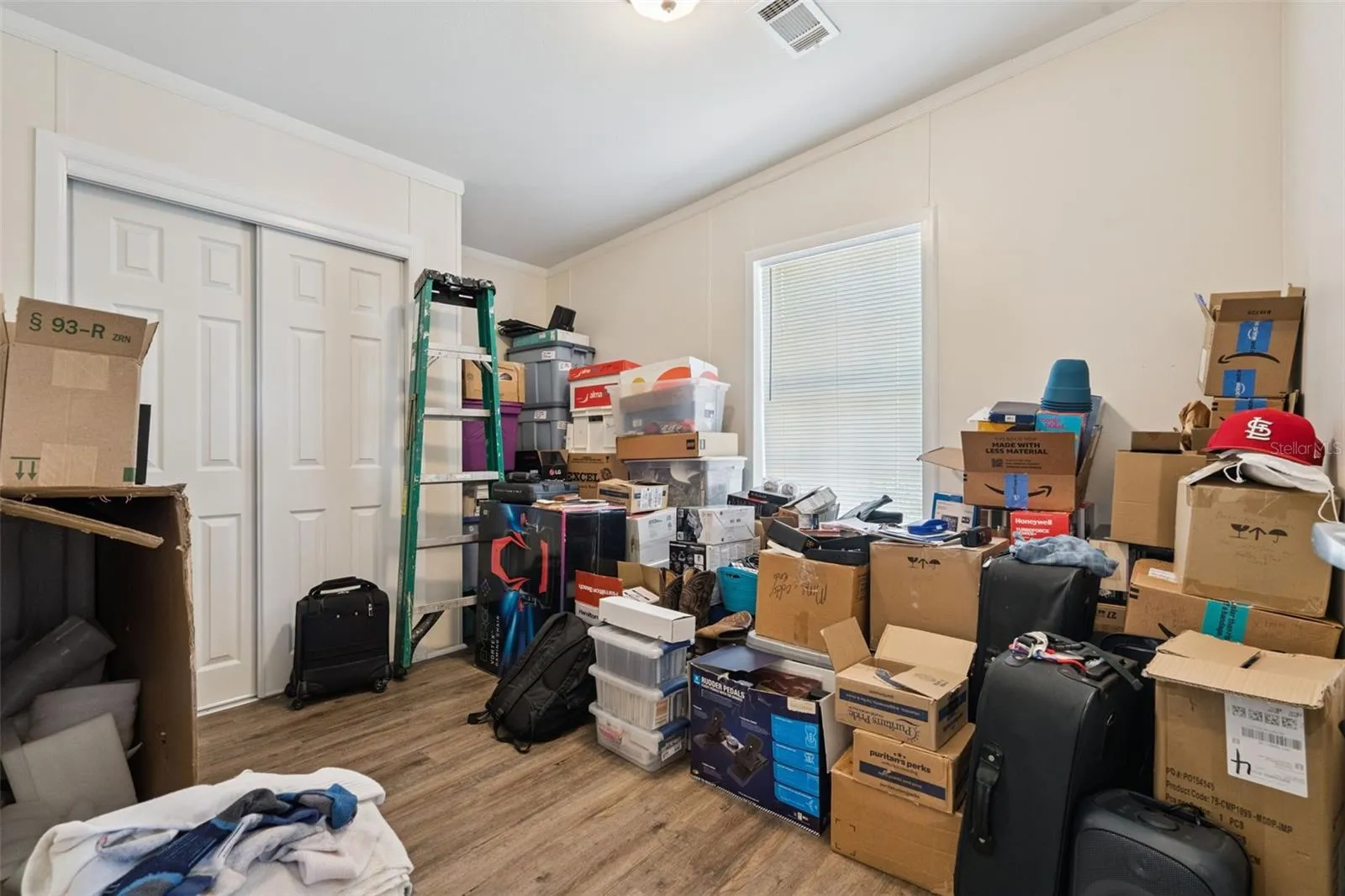 Bedroom #4 features vinyl plank flooring