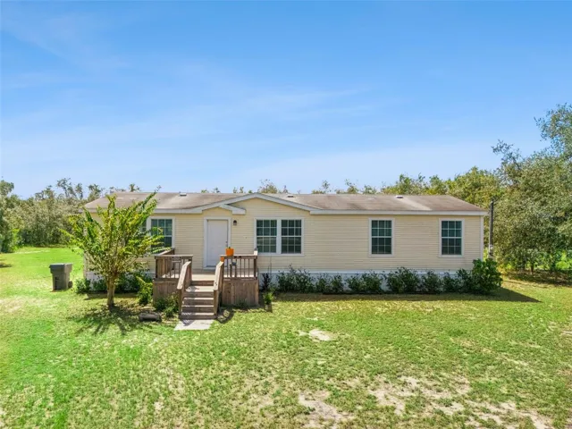 This  4-bedroom, 2-bath double-wide manufactured home is located in the peaceful Lake Pierce Ranchettes community with NO HOA!