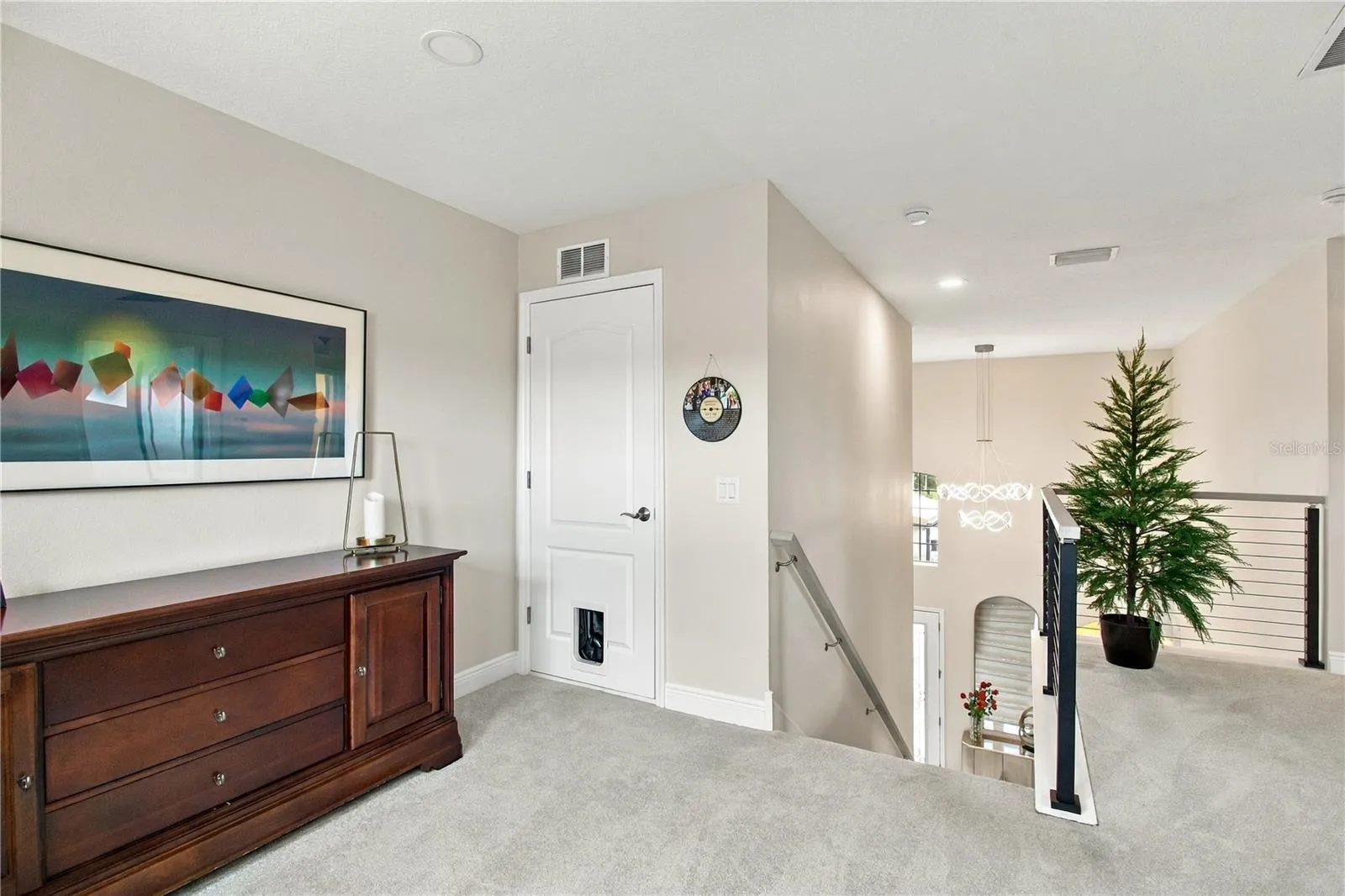 Bedroom with dresser and bathroom access