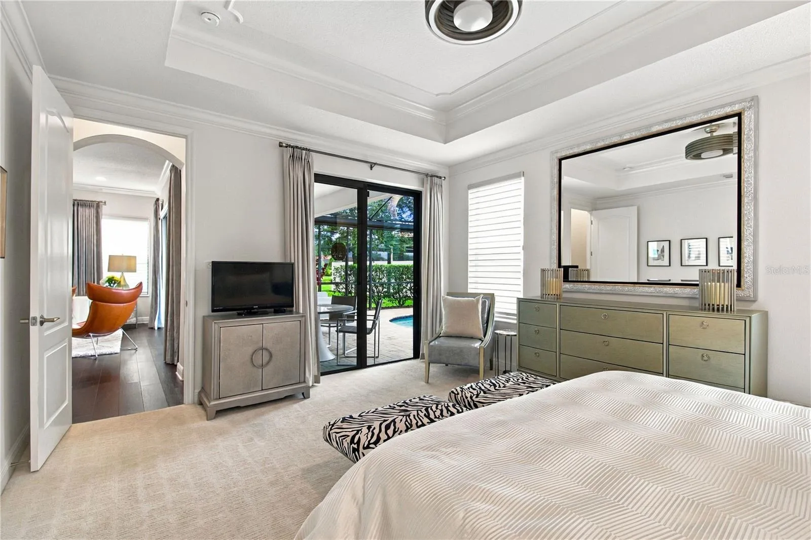 Bedroom with bed and doorway to adjoining space