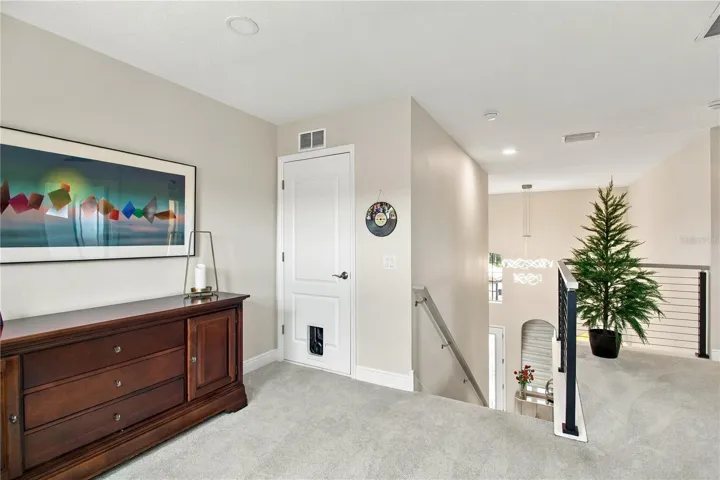 Bedroom with dresser and bathroom access