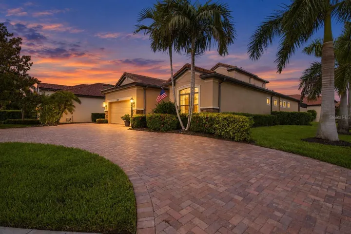 Twilight front exterior with warm exterior lighting