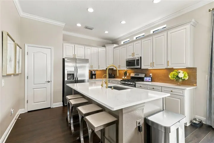 Kitchen with island, range and cabinetry
