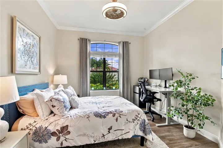 Bedroom with bed and windows