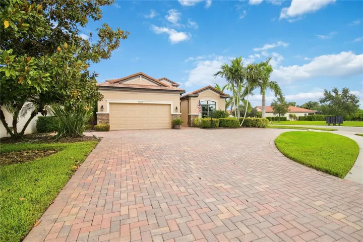 Wide driveway approach and front lawn