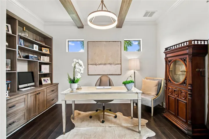 Kitchen with cabinetry, island and dining area