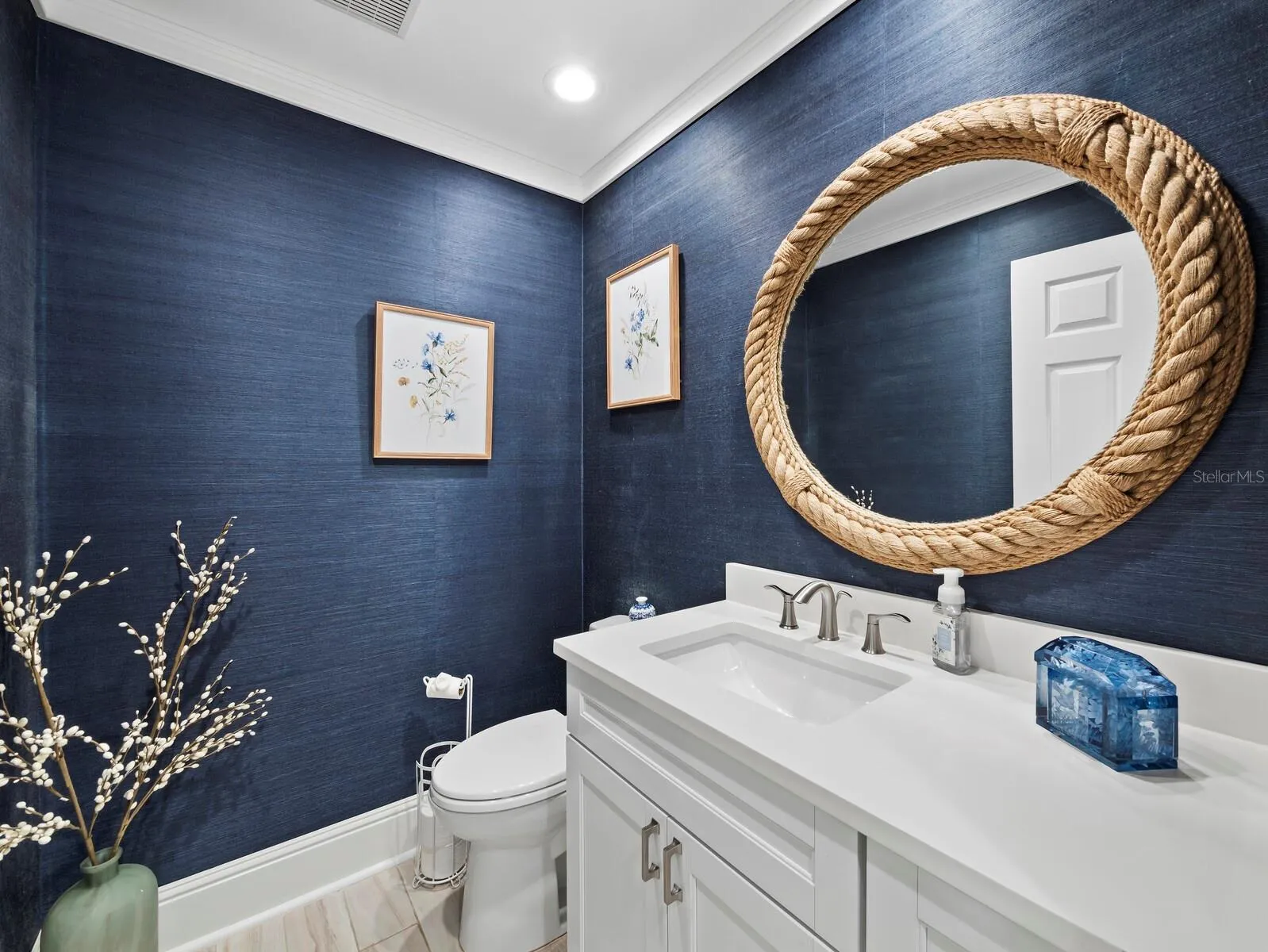 Guests will enjoy this stylist powder room