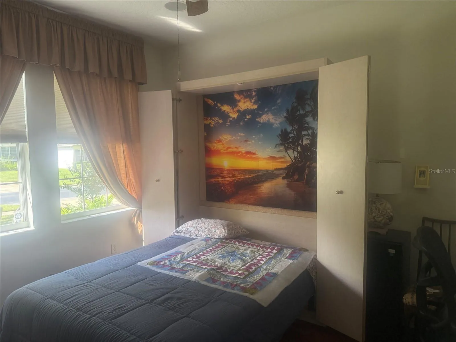 Guest bedroom with murphy bed, built in cabients