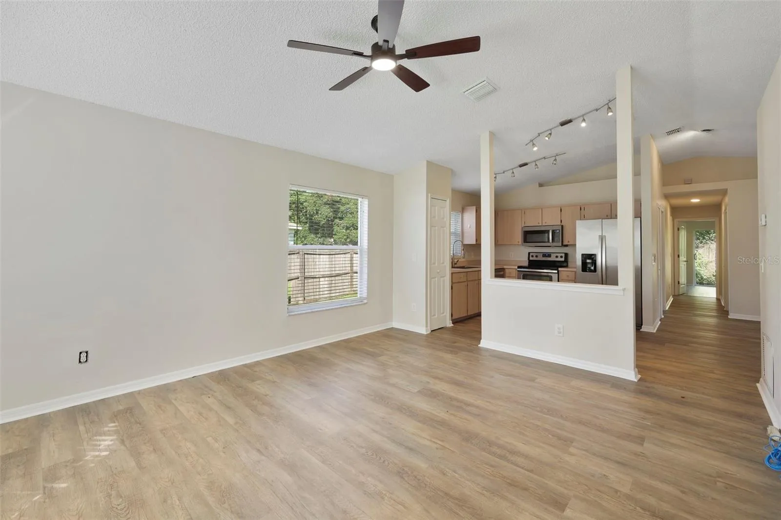 Living room with opening to kitchen