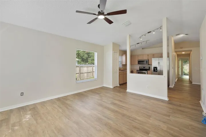 Living room with opening to kitchen