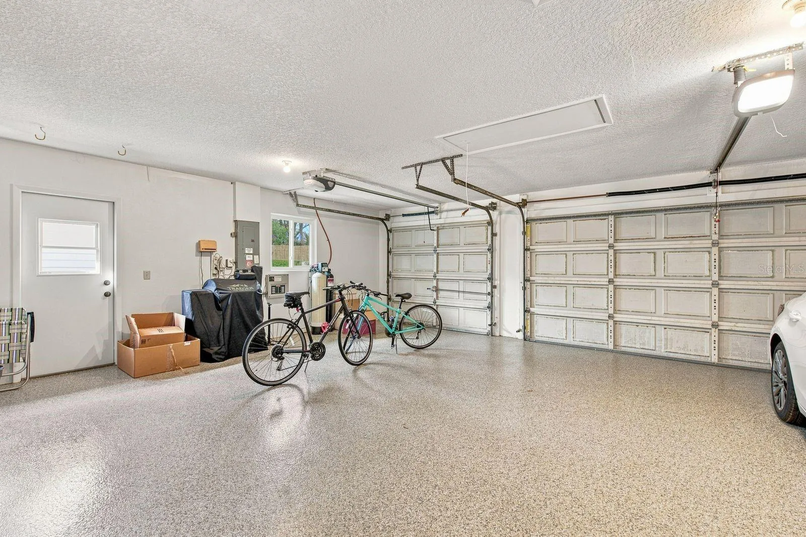 3 car garage with freshly epoxied garage floor
