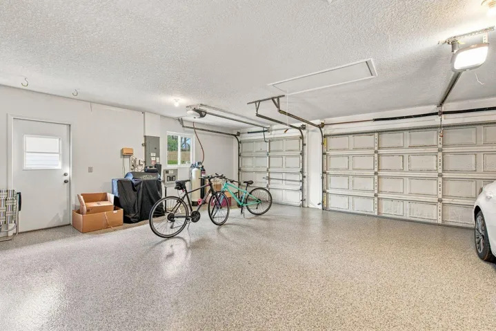 3 car garage with freshly epoxied garage floor