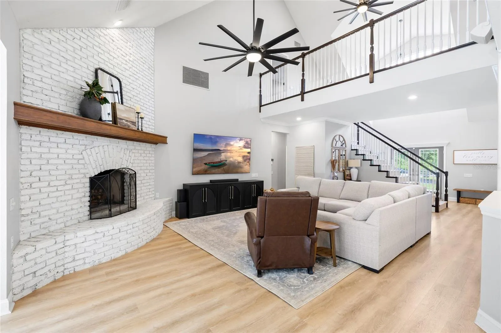 Great room from pool doors. Looking toward foyer and upstairs loft.