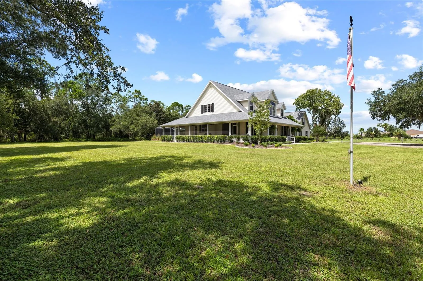 View of home and property front and wrap around porch.