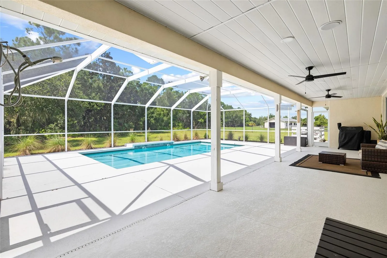 Pool area. Saltwater pool, screened and covered.
