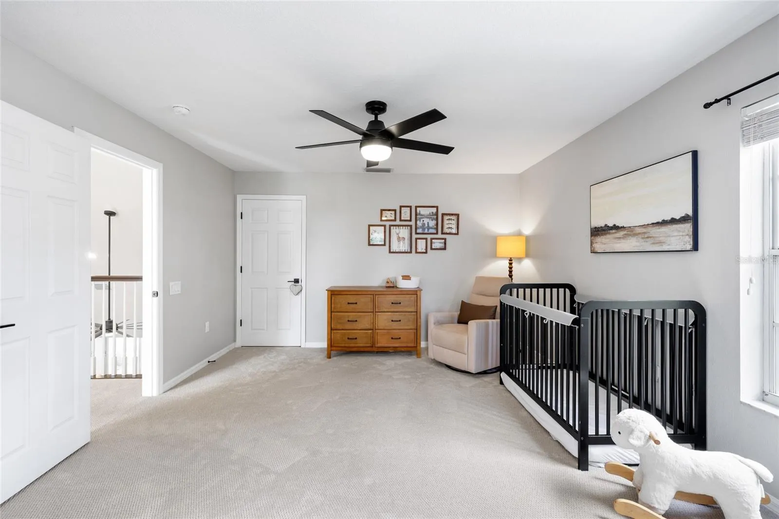 Bedroom 3 from double closets and dormer area. Door by dresser leads to a spacious 13' X 9 storage area.