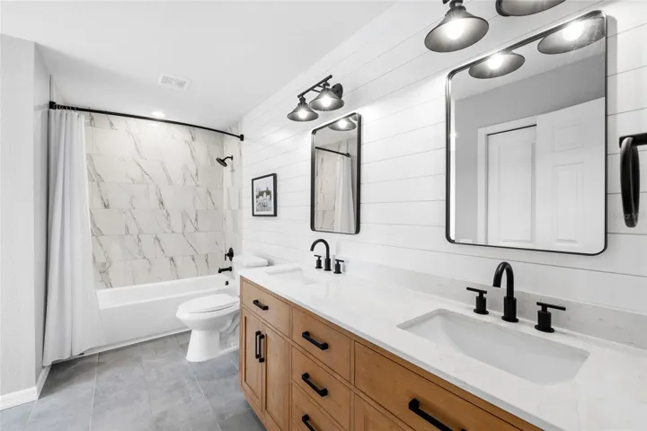 Secondary bathroom - tub and shower.