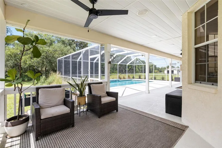 Seating area - from wrap around porch. Over loooking pool area.