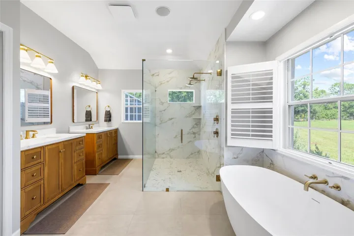 Primary ensuite bath. Split - dual vanities, double shower heads, soaking tub, walk in closet and private water closet.