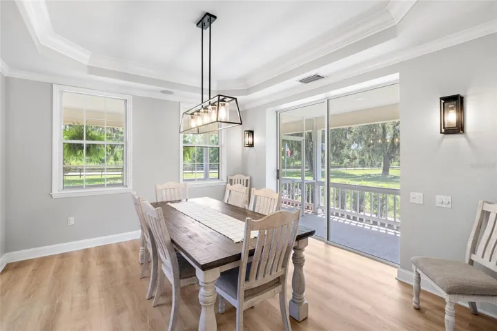 Formal dining room from kitchen. Over looks wrap around porch.