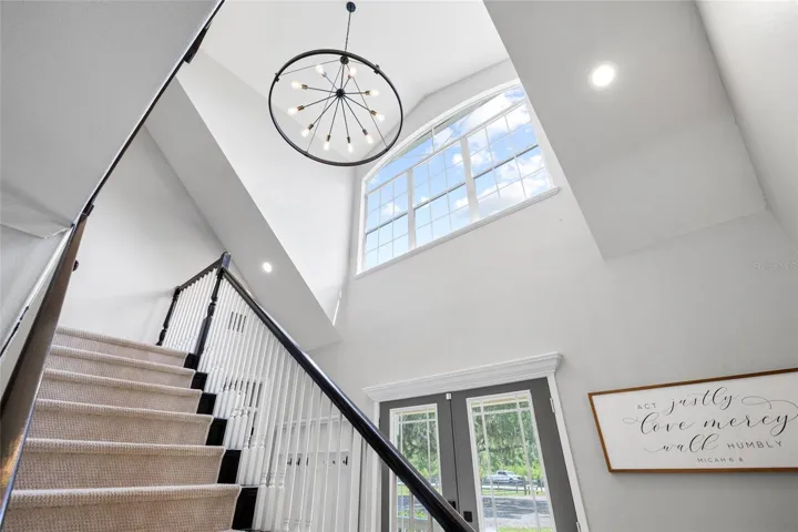 Stairs to loft area, and additional bedrooms, bath and storage area.