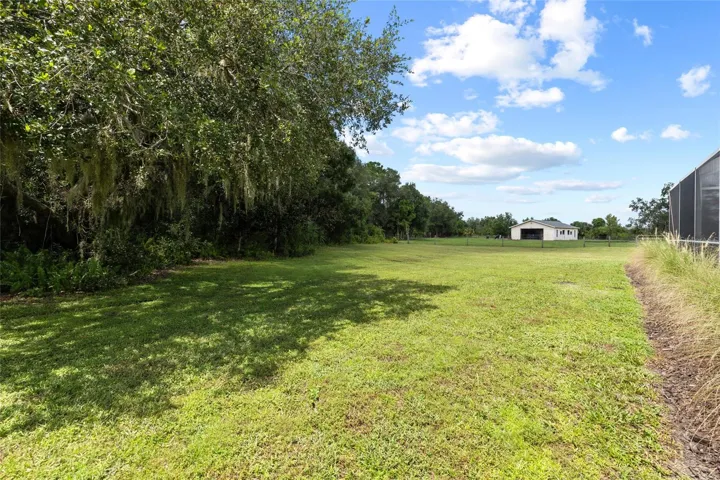 Back of property. Behind pool and looking toward barn.  Fully fenced property.
