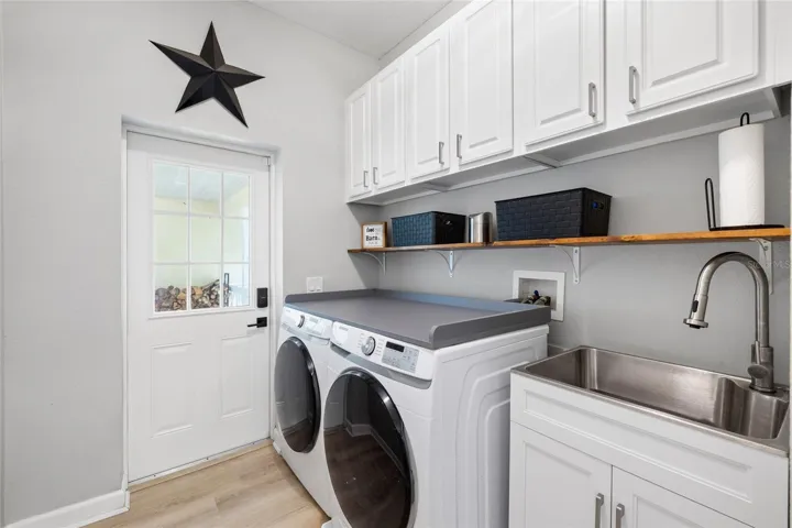 Laundry/Utility room.  Door leads to breezeway and garage.