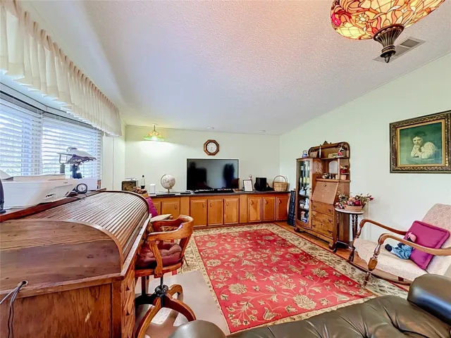 Built in cabinetry provides lots of storage in the living room