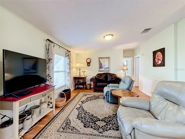 Spacious family room sits alongside kitchen