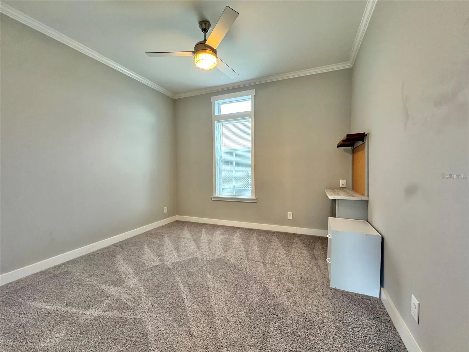 Bedroom 2 with built-in desk.