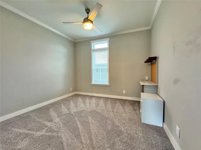 Bedroom 2 with built-in desk.