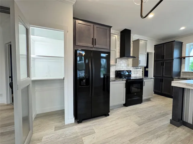 Lighted pantry closet.