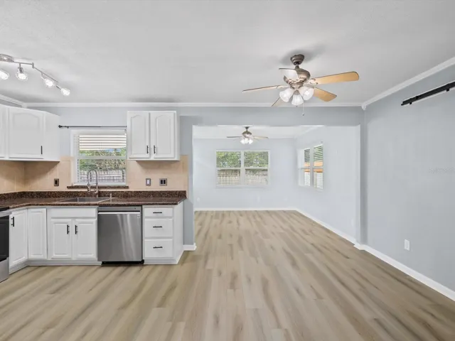 Kitchen area with dining area and bonus room