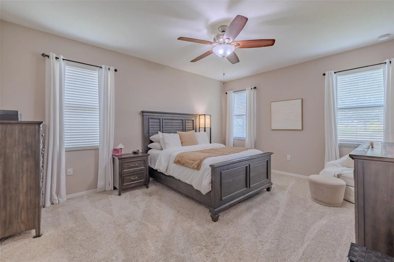Primary bedroom with his & hers walk-in closets