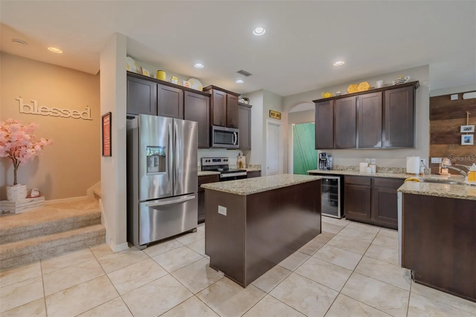 Kitchen with stairway to bonus room