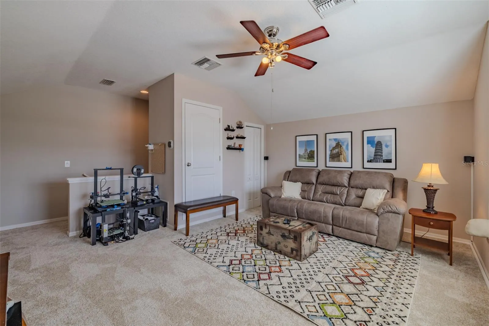 Awesome bonus room with lovely window seat. Bonus room sofa and TV stand convey.