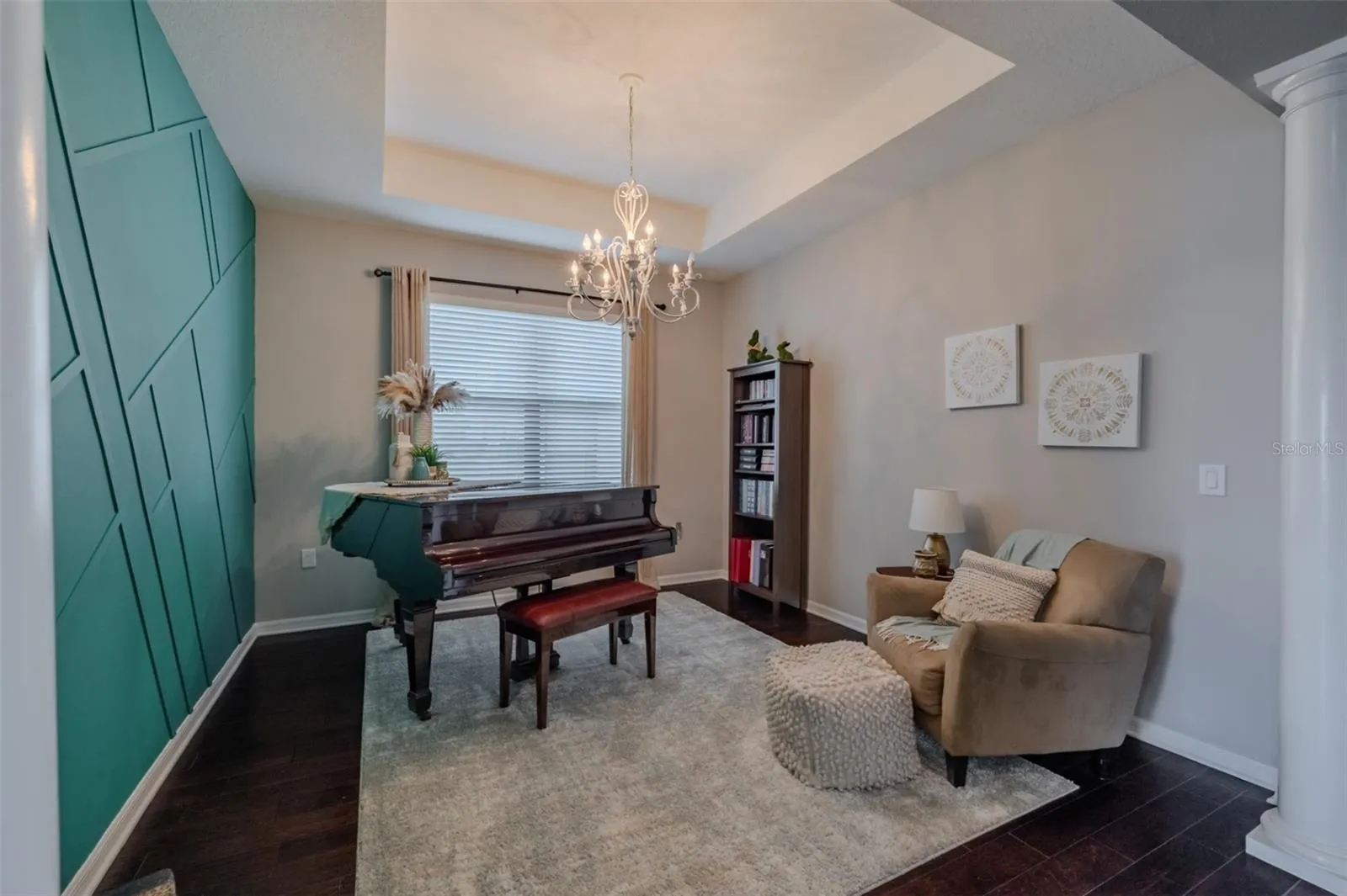 Formal dining room used as piano room with tray ceiling