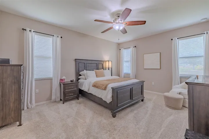 Primary bedroom with his & hers walk-in closets