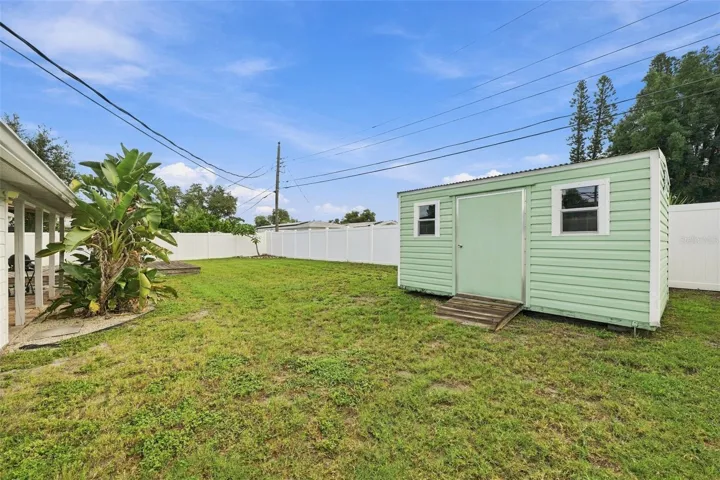 Spacious, fenced backyard with shed.