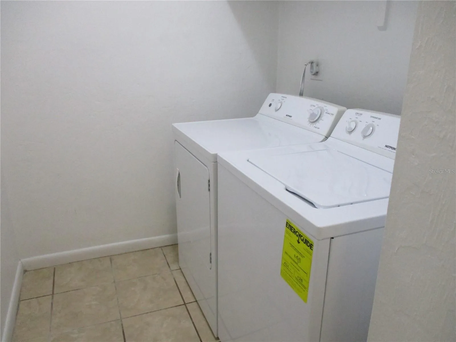 Separate laundry room off kitchen with washer and dryer included
