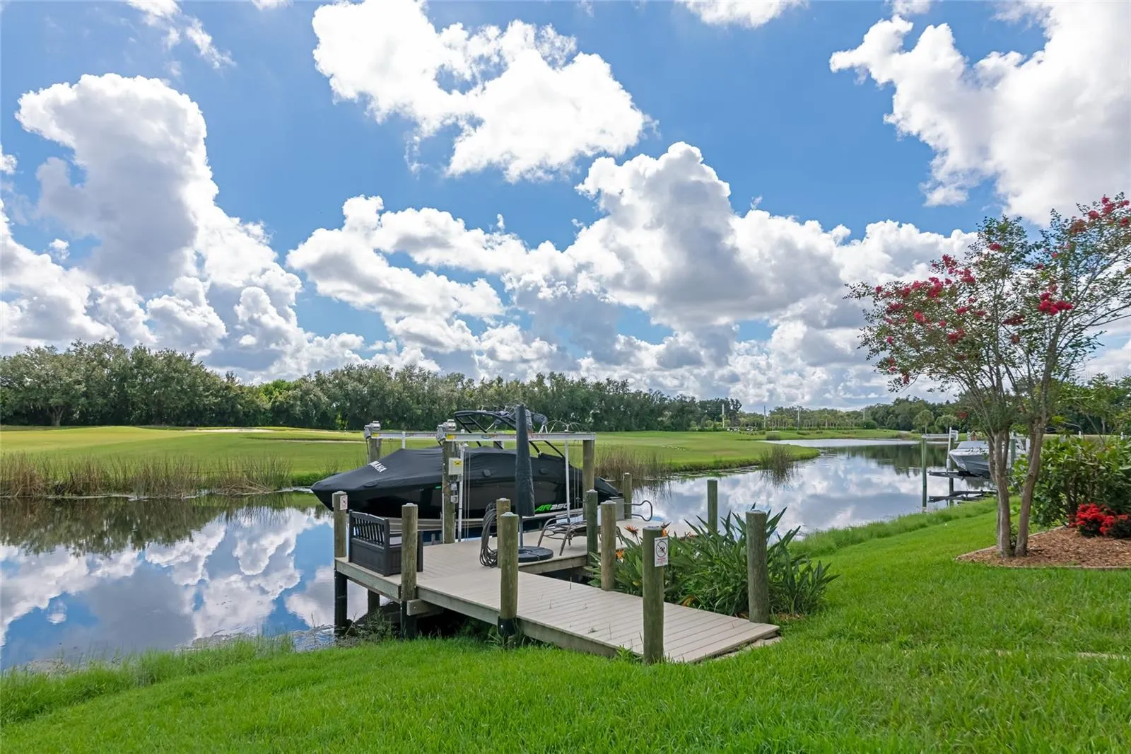Boat dock built in 2024 with 10,000 lb boat lift and composite decking.  Golf course views.